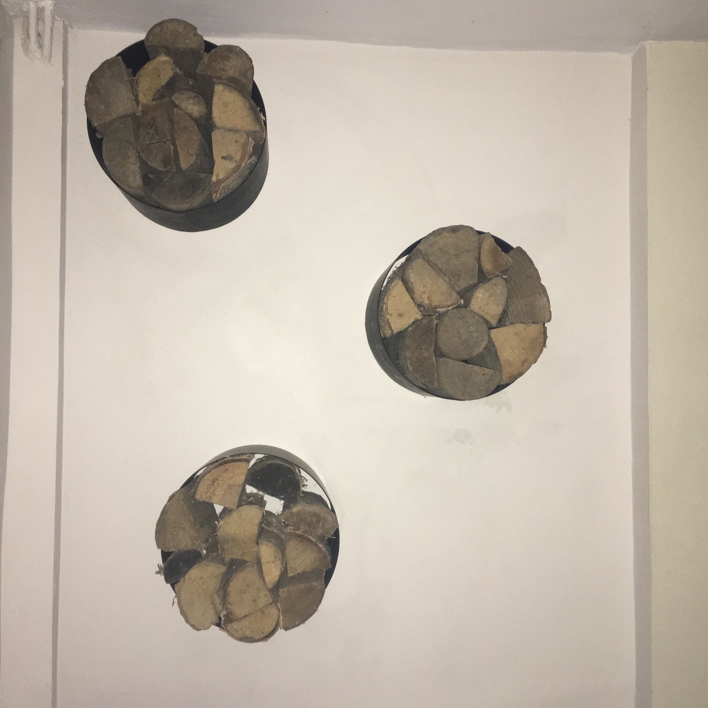 Wall mounted log holder